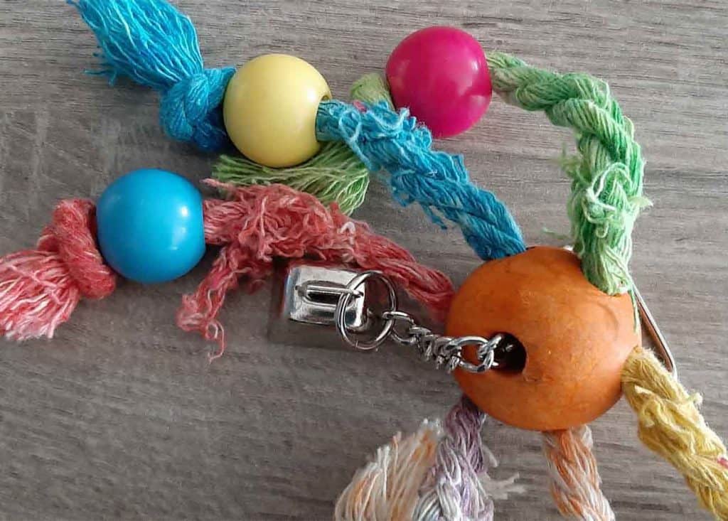 Bird toy with fraying because of chewing on it
