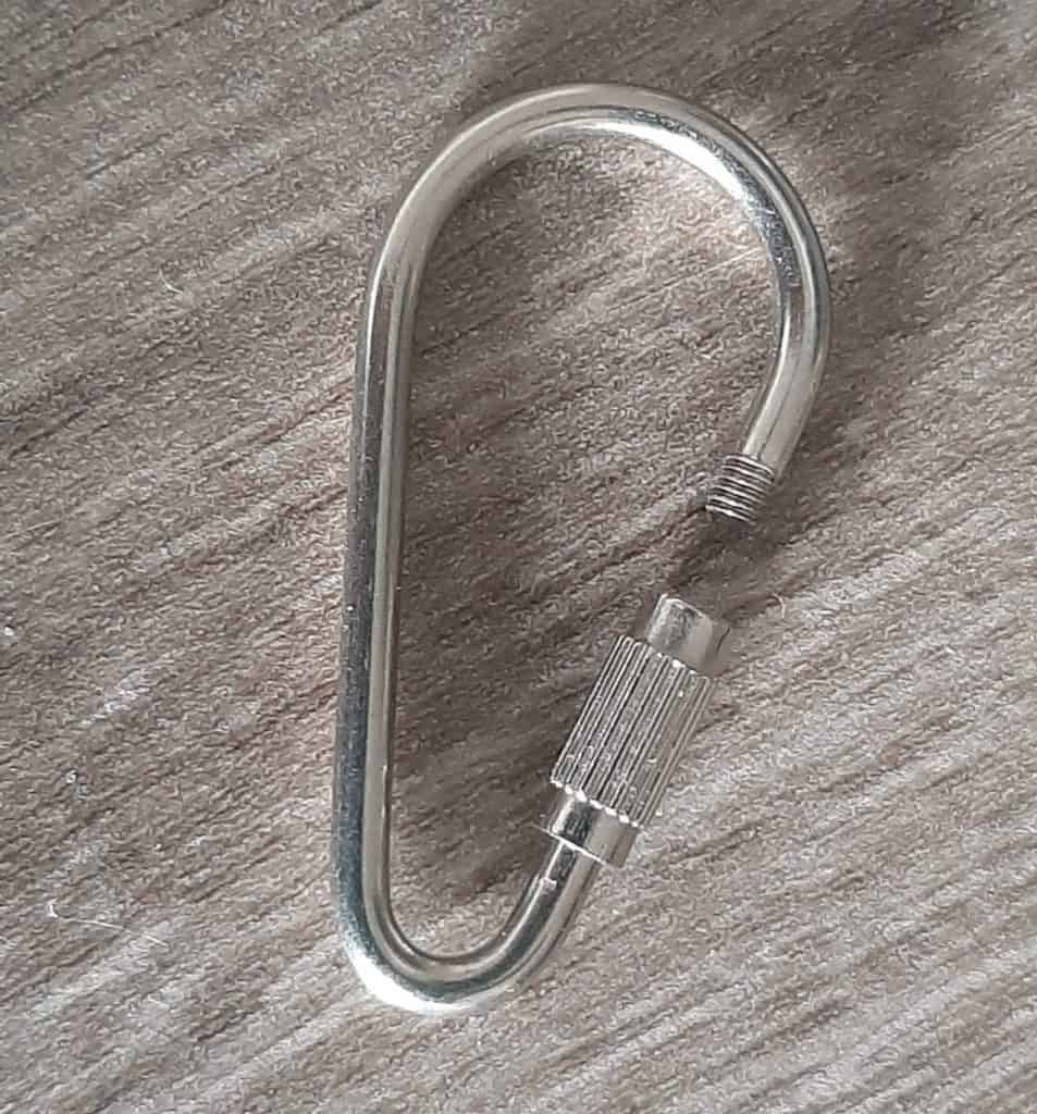 A stainless steel quicklink from a old bird toy that was shredded to pieces.